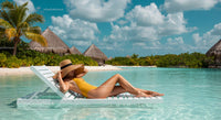 Woman Relaxing Poolside at Tropical Beach Resort