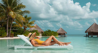 Woman Relaxing by Tropical Pool in Yellow Swimsuit