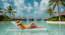 Relaxing Woman Sunbathing by Tropical Bungalows