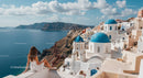 Panoramic View of Santorini's Blue Domes and Sea