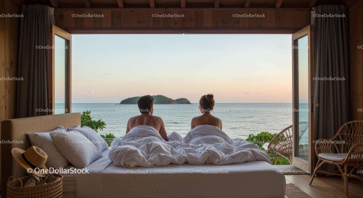 Couple Enjoying Ocean View from Beachfront Bedroom