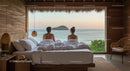 Couple Enjoying Ocean View from Beachside Bungalow