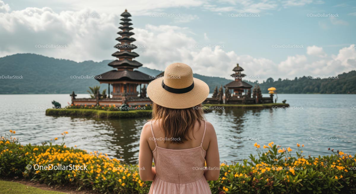Woman in Hat Admiring Ulun Danu Bratan Temple in Bali