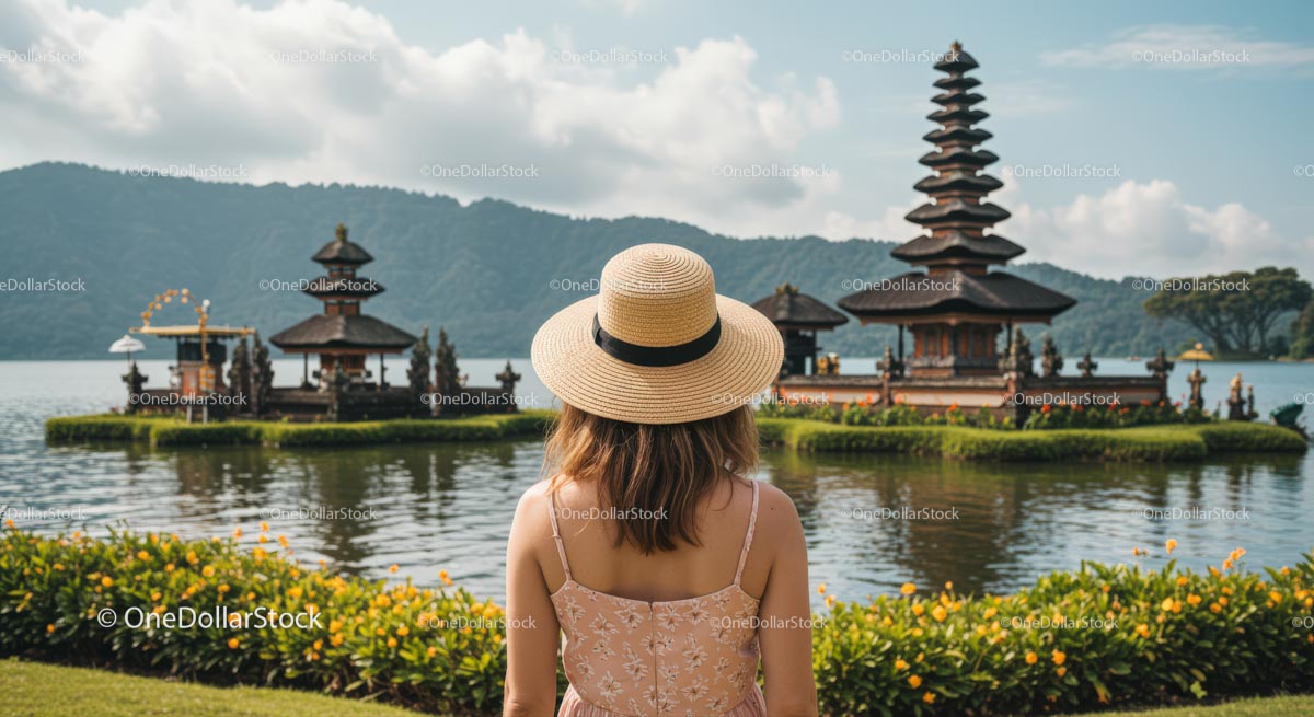 Woman in Hat Admiring Ulun Danu Bratan Temple in Bali