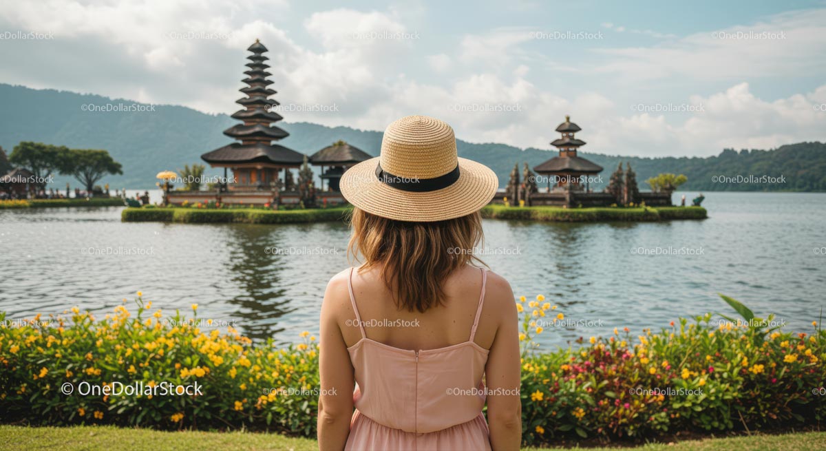 Woman in Hat Admiring Ulun Danu Bratan Temple in Bali