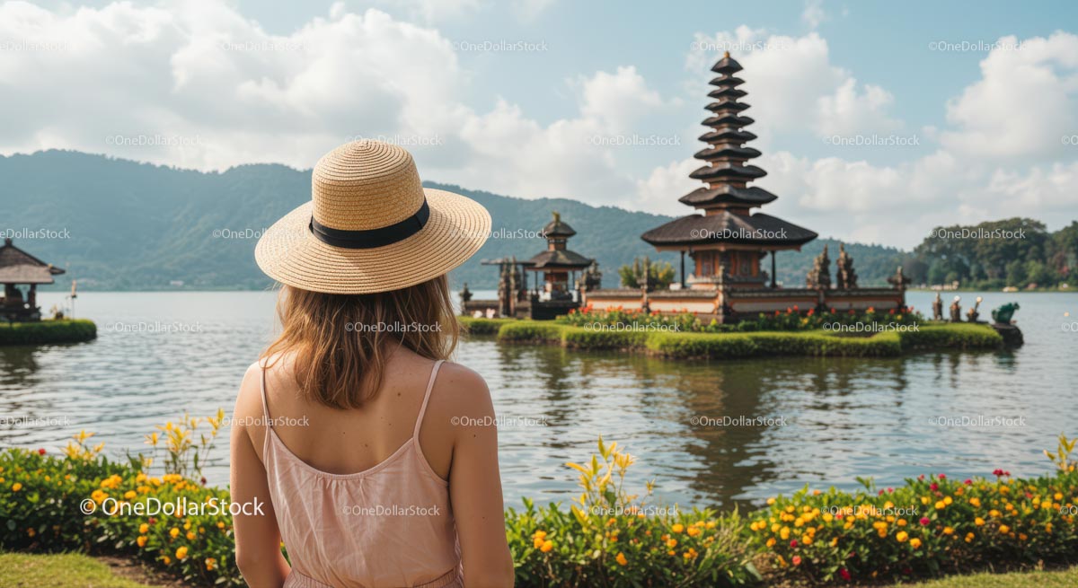 Woman in Hat Admiring Ulun Danu Bratan Temple in Bali
