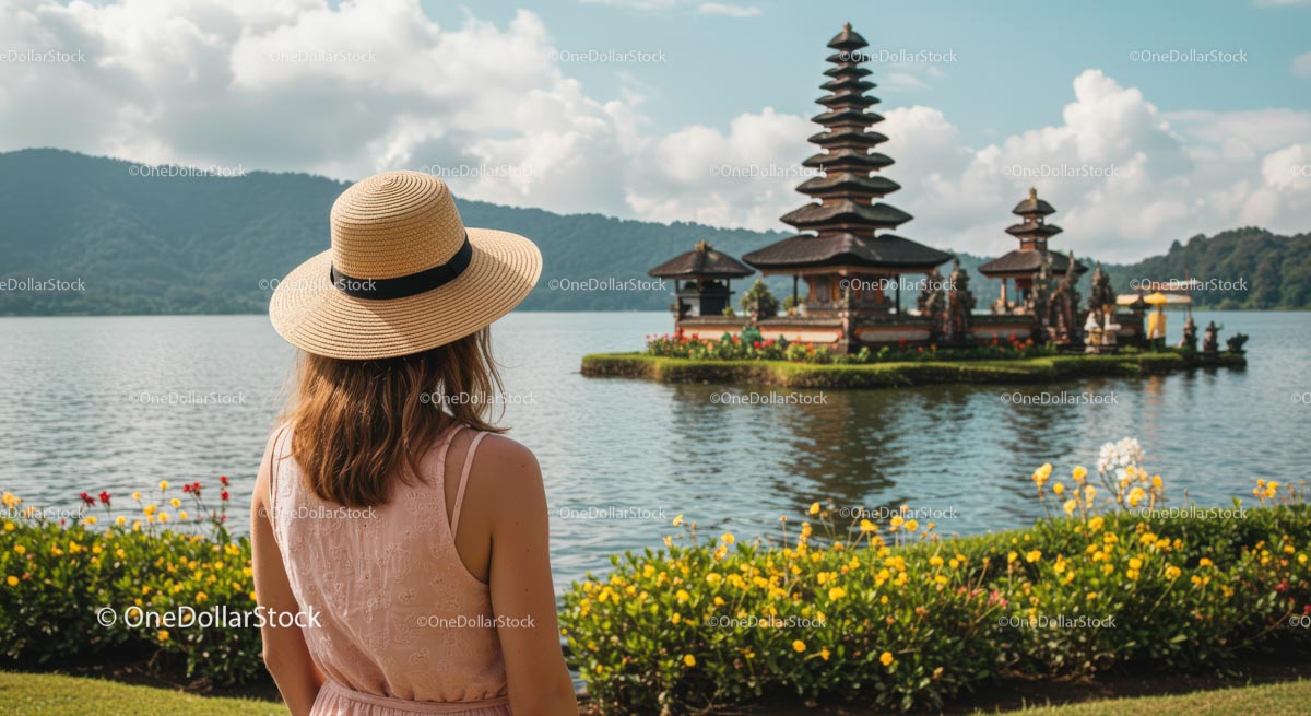 Woman in Hat Admiring Ulun Danu Bratan Temple in Bali
