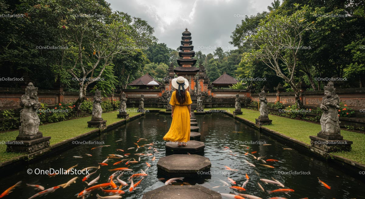Woman in Yellow Dress at Balinese Temple with Koi Fish