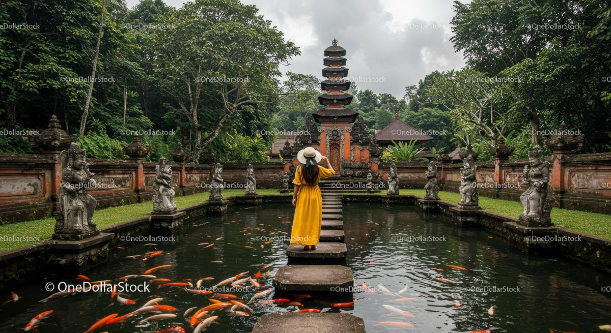 Woman in Yellow Dress at Balinese Reflection Pool with Koi Fish