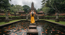 Woman in Yellow Dress at Balinese Temple with Koi Pond
