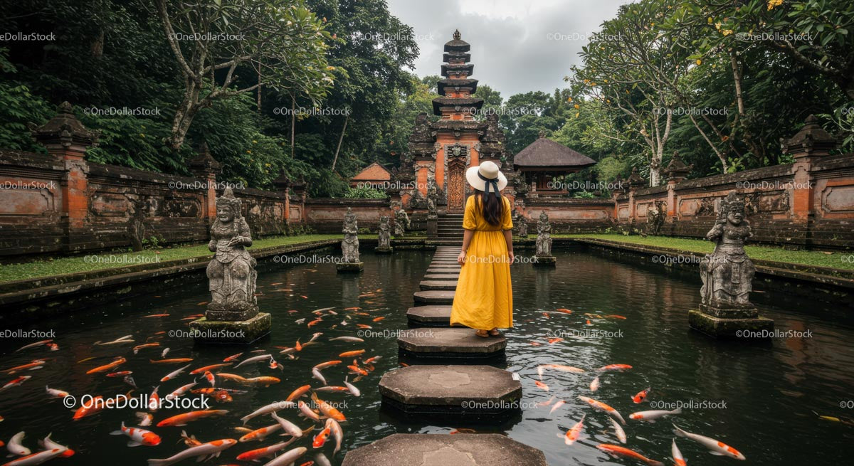 Woman in Yellow Dress at Exotic Bali Temple and Koi Pond