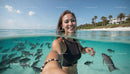 Woman Enjoying Tropical Beach and Clear Ocean Waters