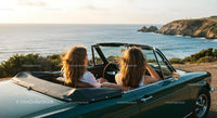 Friends Enjoying a Scenic Coastal Drive in Convertible