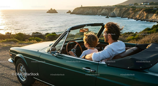 Father and Son Driving Convertible Along Scenic Coast