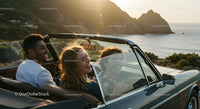 Friends on a Coastal Road Trip in Convertible Car