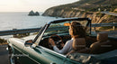 Friends on a Coastal Road Trip in Convertible Car
