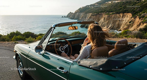 Woman Enjoying Drive in Classic Convertible by the Coast