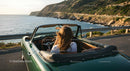 Friends on a Coastal Road Trip in Convertible Car