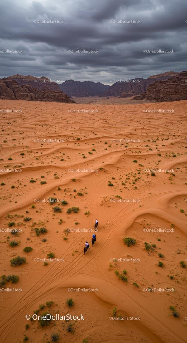 Horseback Riders Traversing Majestic Desert Dunes