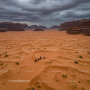 Horse Riders Crossing Majestic Desert Landscape
