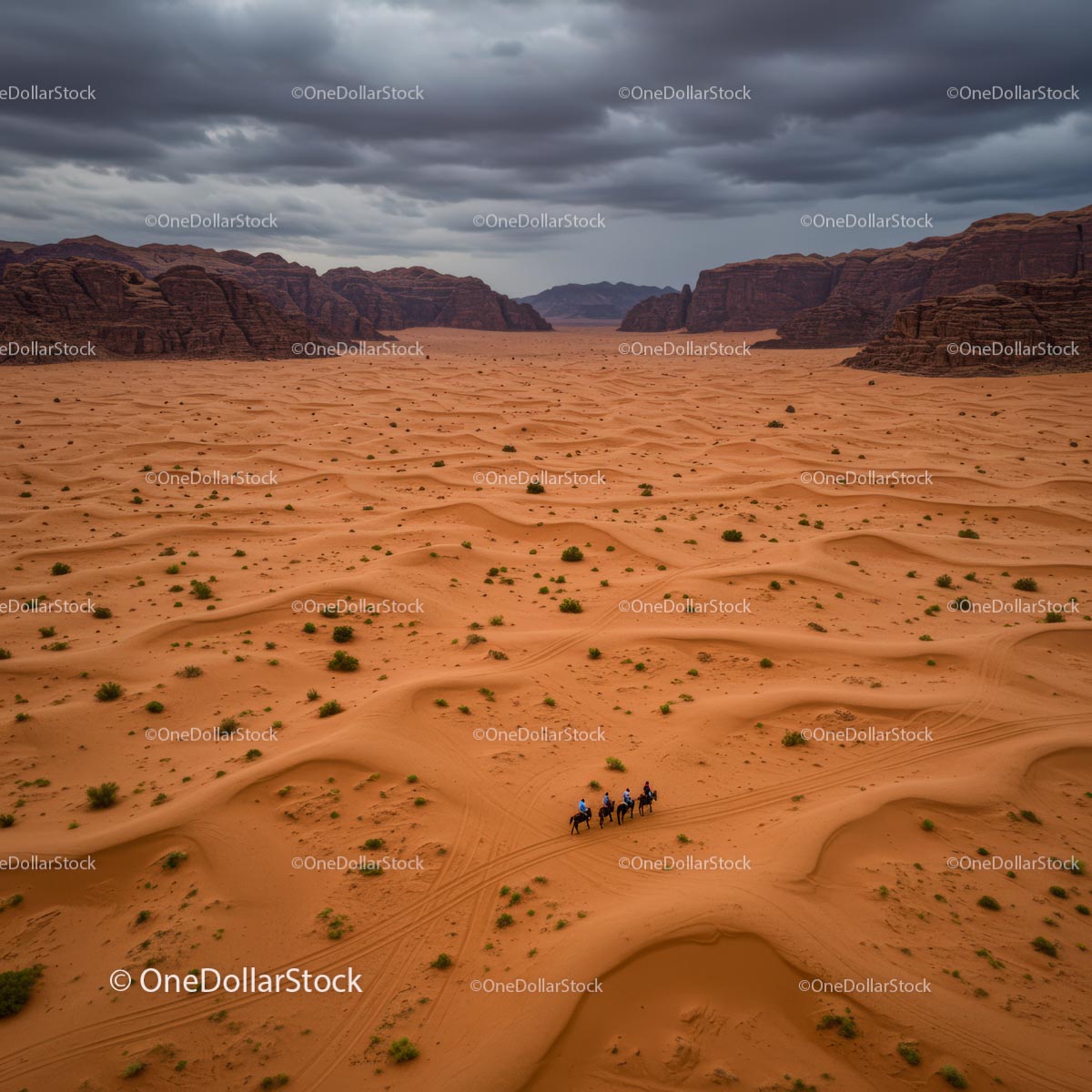 Riders Journeying Across Dramatic Desert Landscape