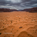 Riders Journeying Across Dramatic Desert Landscape