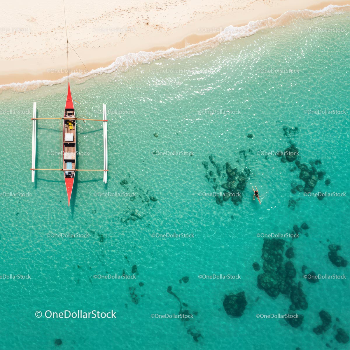 Aerial View of Traditional Boat on Turquoise Tropical Waters