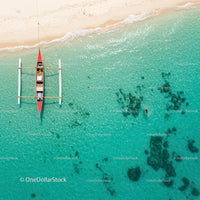Aerial View of Traditional Boat on Turquoise Tropical Waters
