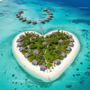 Heart-Shaped Island with Overwater Bungalows in Turquoise Sea