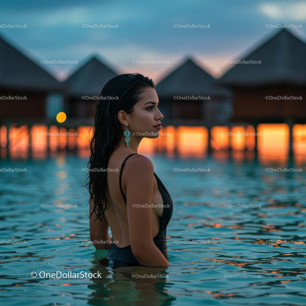 Woman Enjoying Sunset at Luxury Overwater Bungalow Resort