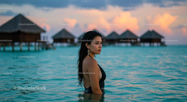 Sunset Tranquility with Woman by Overwater Bungalows