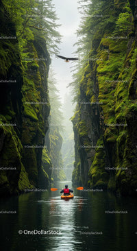 Kayaker Navigating Through Verdant River Canyon