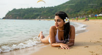 Woman Relaxing on Tropical Beach with Ocean View