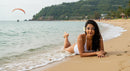Woman Relaxing on Tropical Beach with Ocean View