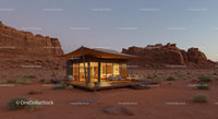 Luxurious Modern Cabin Amidst Desert Cliffs at Sunset