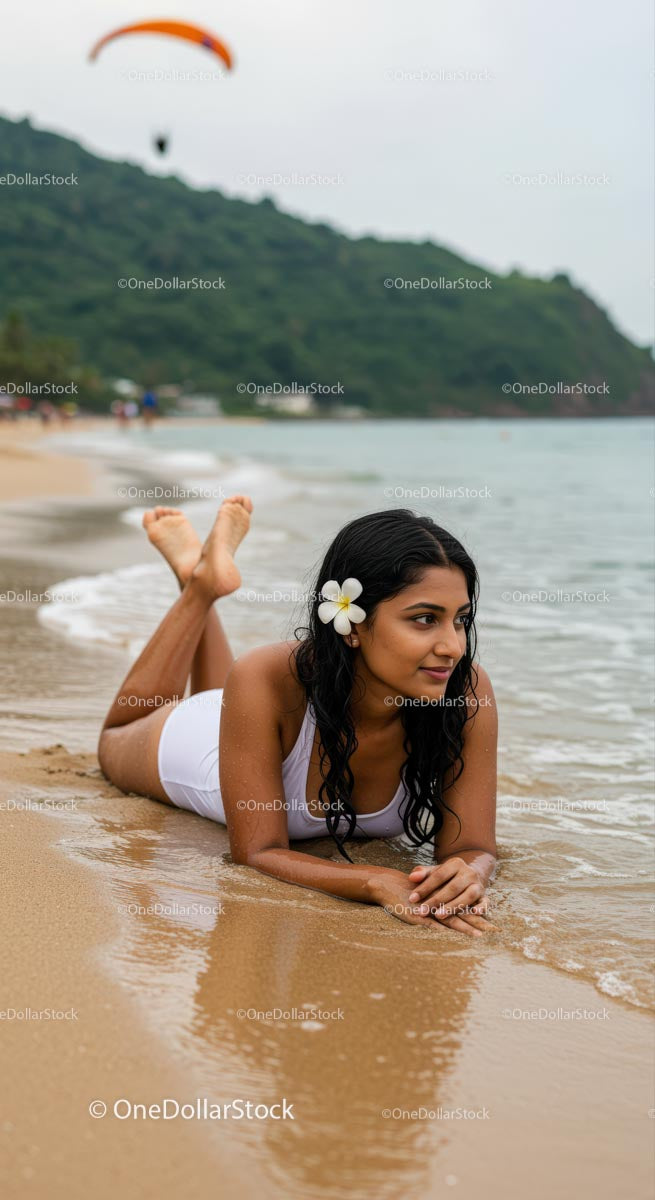 Woman Relaxing on Tropical Beach with Flower in Hair