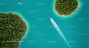 Aerial View of Speedboat Amidst Turquoise Waters and Lush Islands