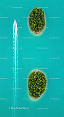 Aerial View of Speedboat Near Lush Islands in Turquoise Waters
