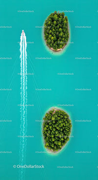 Aerial View of Speedboat Near Lush Islands in Turquoise Waters