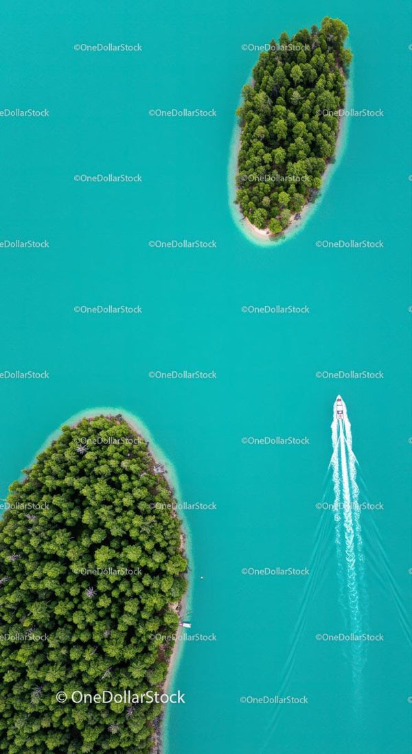 Aerial View of Lush Island in Turquoise Waters