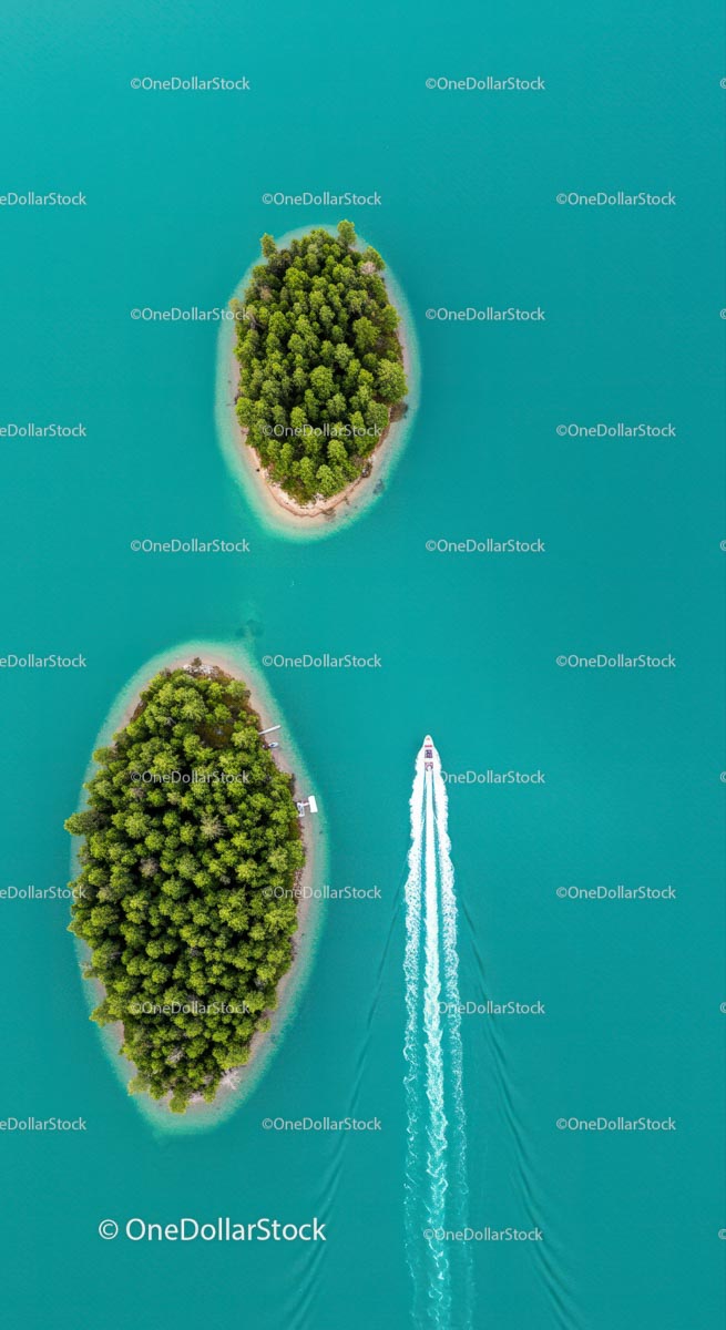 Aerial View of Tropical Islands with Speedboat on Turquoise Water