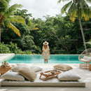 Woman Enjoying Tropical Poolside Oasis with Palm Trees