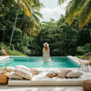Woman Relaxing by Luxurious Pool in Tropical Paradise