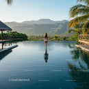 Woman Enjoying Serene Infinity Pool with Mountain Views