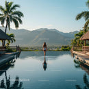 Infinity Pool with Mountain and Palm Tree View at Sunrise