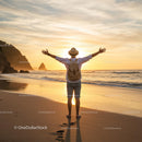 Man Embracing Sunset on a Tranquil Beach