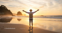 Backpacker Enjoying Freedom at Sunrise Beach