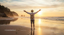 Man Embracing Freedom on Sunlit Beach at Golden Hour