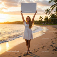Joyful Woman Holding Blank Sign at Sunset on Tropical Beach