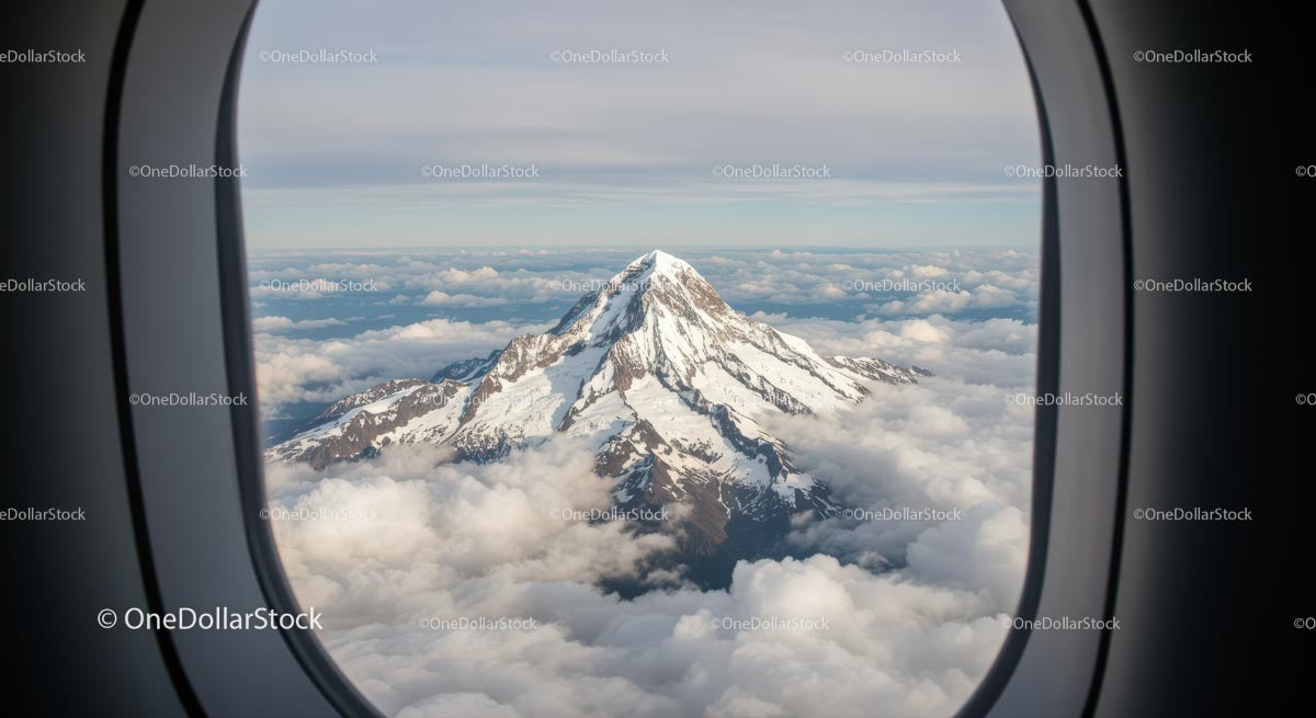 Snow-Capped Mountain View from Airplane Window